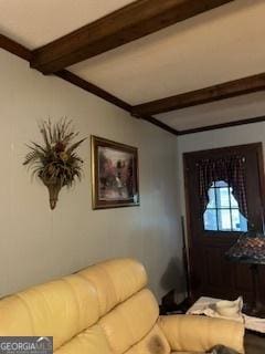 living room with beam ceiling