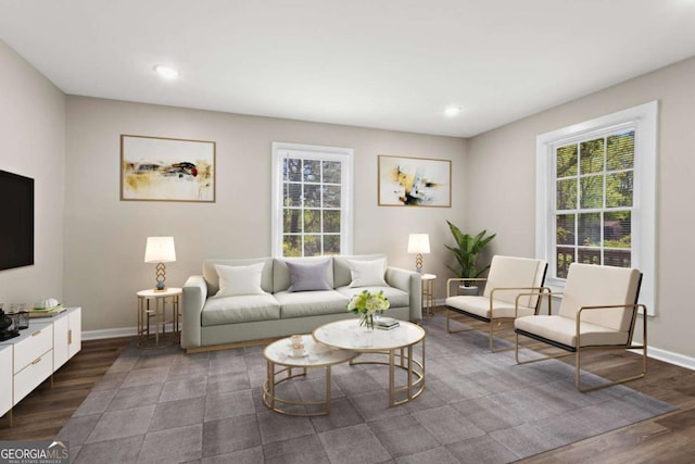 living area featuring recessed lighting, baseboards, and wood finished floors