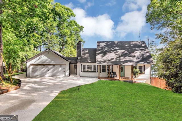 276 Greentree Pkwy, Macon, GA 31220 - cape cod home with a garage, fence, a front yard, a chimney, and concrete driveway