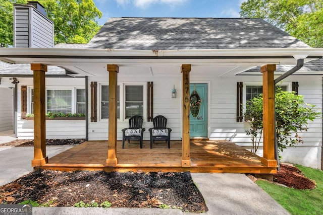276 Greentree Pkwy, Macon, GA 31220 - back of house with roof with shingles, covered porch, and a chimney