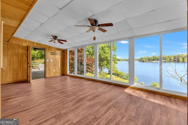 276 Greentree Pkwy, Macon, GA 31220 - unfurnished sunroom featuring wood finished floors, lofted ceiling, wooden walls, a paneled ceiling, and a water view