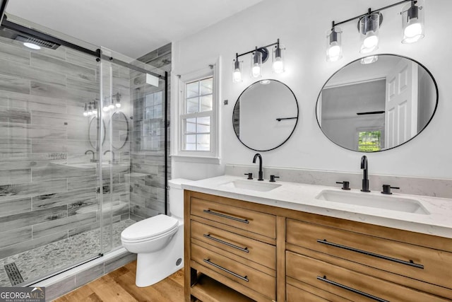 276 Greentree Pkwy, Macon, GA 31220 - bathroom featuring double vanity, toilet, a shower stall, and a sink