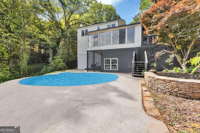276 Greentree Pkwy, Macon, GA 31220 - view of pool with stairway, a patio, a swimming pool, and a sunroom