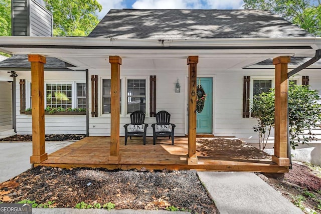 276 Greentree Pkwy, Macon, GA 31220 - exterior space with a porch, a shingled roof, and a chimney