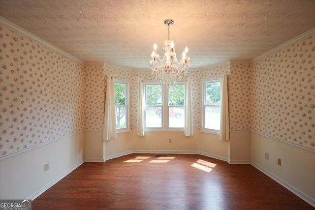 unfurnished dining area featuring wallpapered walls, wood finished floors, and a notable chandelier