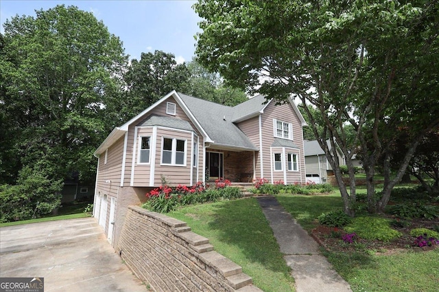 view of front of property featuring a garage, covered porch, concrete driveway, and a front yard