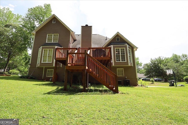 back of property with central AC, a wooden deck, a chimney, a lawn, and stairway