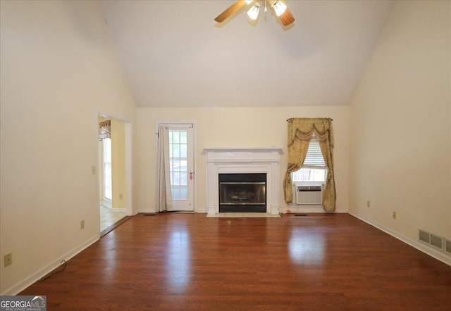 unfurnished living room with visible vents, ceiling fan, lofted ceiling, and wood finished floors