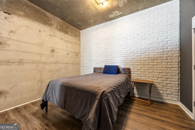 400 W Peachtree St NW Unit 3614, Atlanta, GA 30308 - bedroom with wood finished floors, brick wall, and baseboards