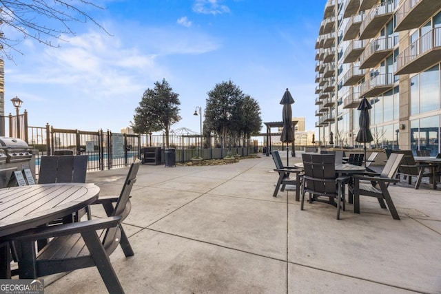 400 W Peachtree St NW Unit 3614, Atlanta, GA 30308 - view of patio with fence, grilling area, and outdoor dining area