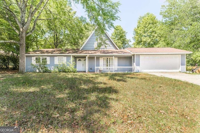 view of front of home featuring a garage, a front lawn, a porch, and driveway