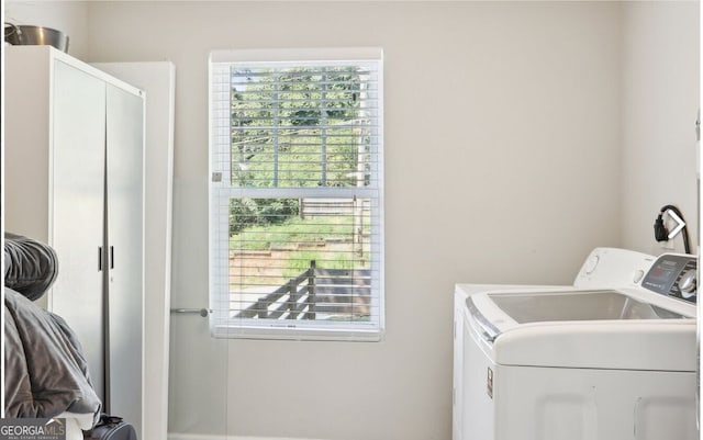 laundry room with separate washer and dryer and laundry area