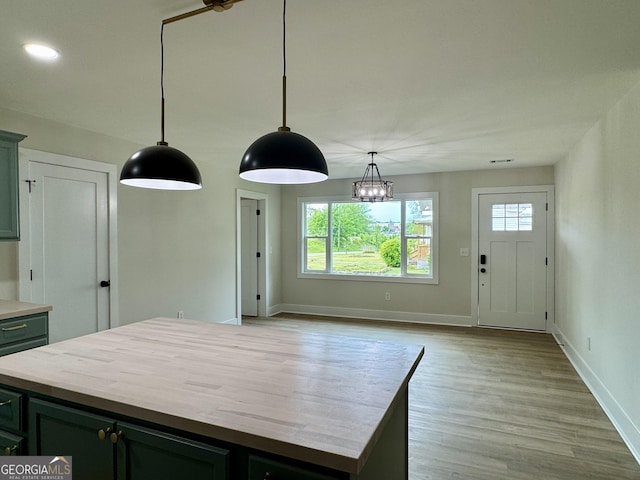 101 Newsome St, Union Point, GA 30669 - kitchen with healthy amount of natural light, baseboards, and pendant lighting