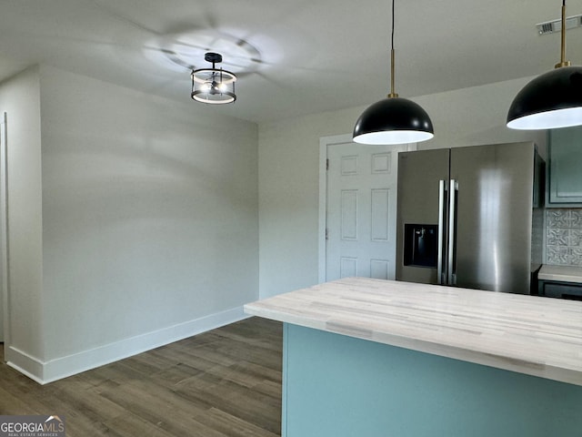 101 Newsome St, Union Point, GA 30669 - kitchen with stainless steel refrigerator with ice dispenser, baseboards, dark wood-type flooring, and light countertops