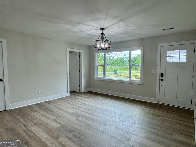 101 Newsome St, Union Point, GA 30669 - unfurnished dining area featuring plenty of natural light, a chandelier, and baseboards