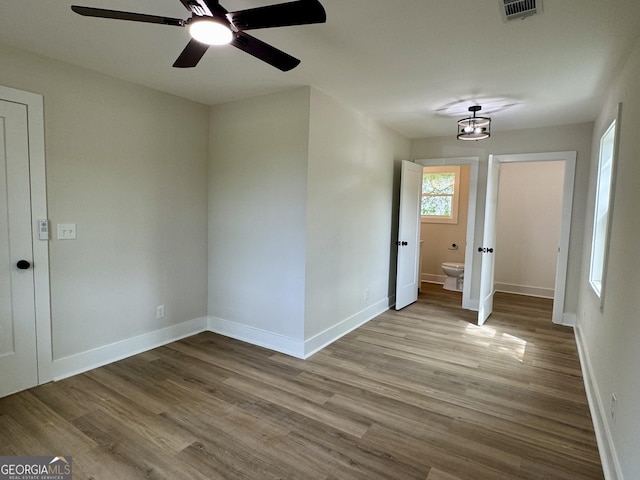 101 Newsome St, Union Point, GA 30669 - unfurnished room featuring wood finished floors, baseboards, and a ceiling fan