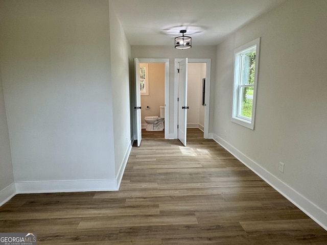 101 Newsome St, Union Point, GA 30669 - corridor featuring baseboards and wood finished floors