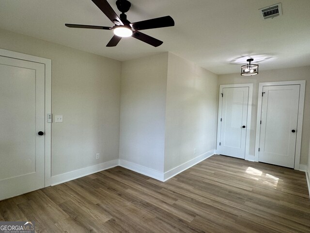 101 Newsome St, Union Point, GA 30669 - unfurnished room featuring wood finished floors, baseboards, and a ceiling fan