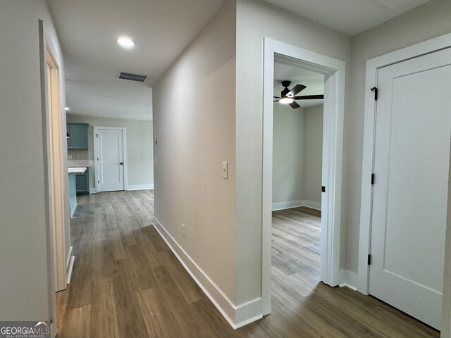 101 Newsome St, Union Point, GA 30669 - hall with dark wood-type flooring, baseboards, and recessed lighting