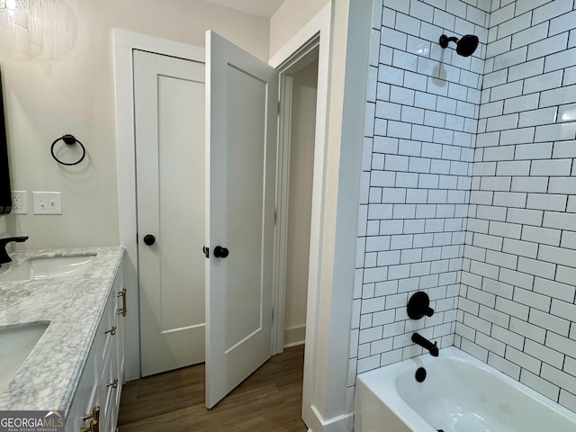 101 Newsome St, Union Point, GA 30669 - bathroom with wood finished floors, shower / bath combination, and double vanity