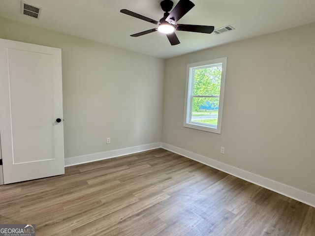 101 Newsome St, Union Point, GA 30669 - empty room featuring wood finished floors, ceiling fan, and baseboards