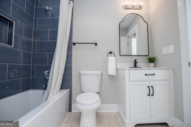bathroom with toilet, shower / bath combination with curtain, vanity, and baseboards