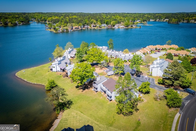 birds eye view of property featuring a water view and a residential view