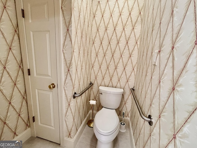 bathroom featuring tile patterned floors and toilet