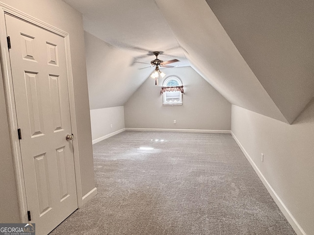 bonus room featuring baseboards, a ceiling fan, carpet floors, and vaulted ceiling