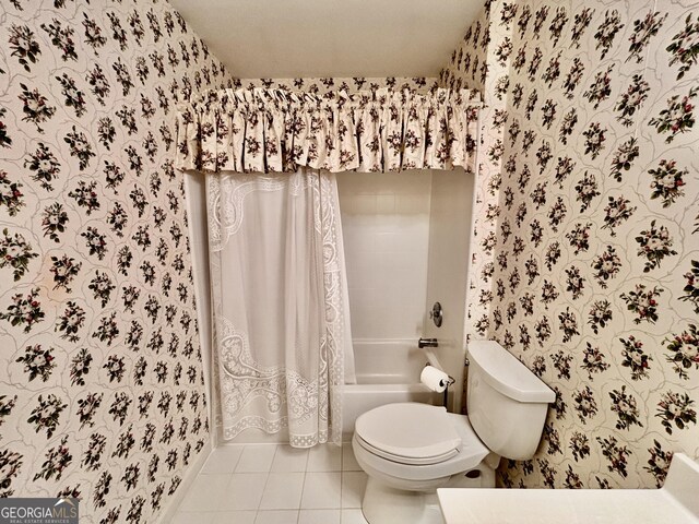 bathroom with tile patterned floors, toilet, wallpapered walls, and shower / tub combo with curtain
