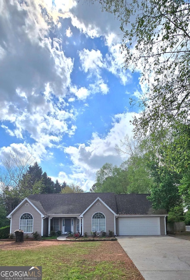 309 Briarwood Dr, Winder, GA 30680 - ranch-style home featuring driveway, an attached garage, and a front lawn
