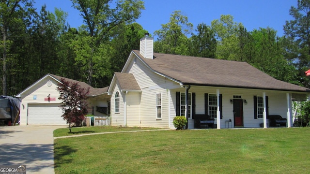 view of front facade featuring a front yard, covered porch, a chimney, concrete driveway, and an attached garage