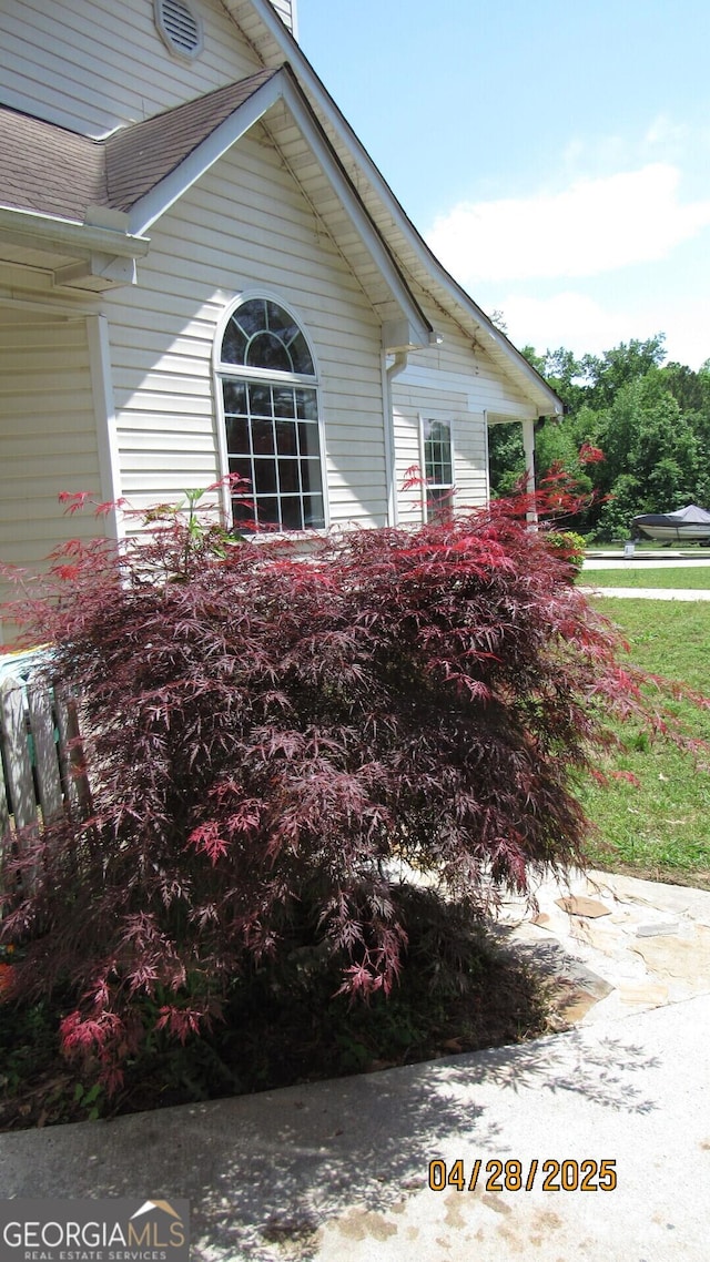 view of home's exterior featuring a shingled roof