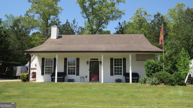 bungalow-style house with a chimney, a porch, and a front lawn