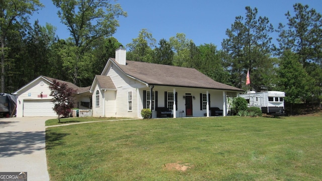 view of front of house featuring a porch, a front lawn, a garage, driveway, and a chimney