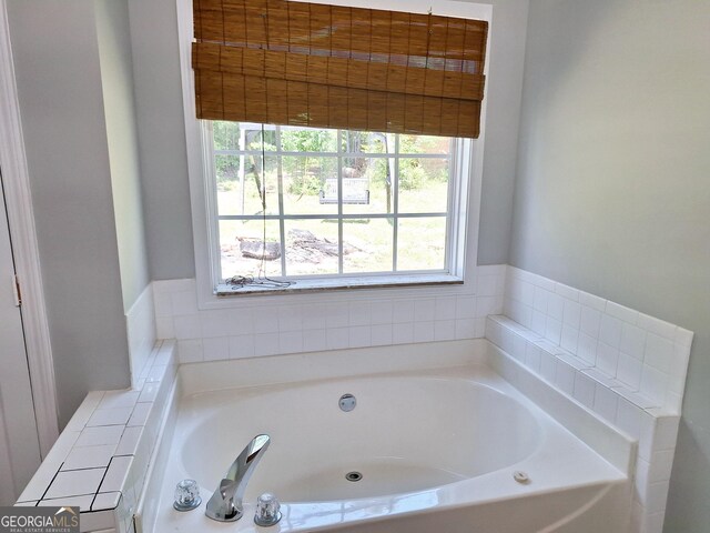 bathroom with a garden tub