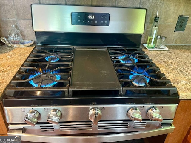 296 Fairview Ct, Jasper, GA 30143 - details with tasteful backsplash and gas range