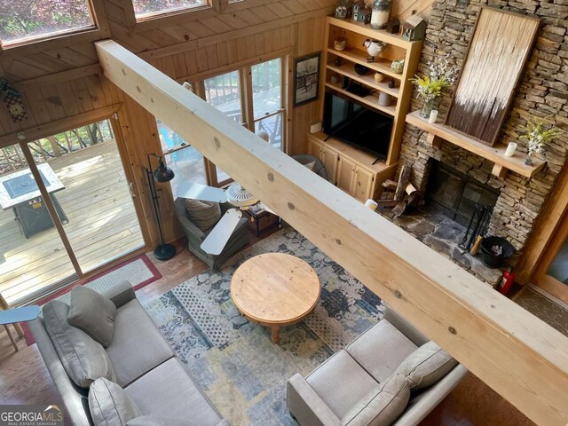 296 Fairview Ct, Jasper, GA 30143 - living area with wood finished floors, wooden walls, and a fireplace