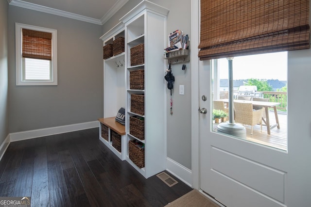 mudroom with crown molding, baseboards, visible vents, and dark wood-type flooring