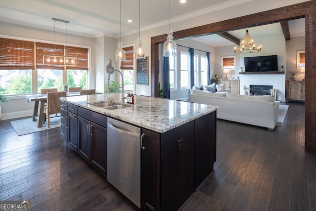 kitchen featuring a sink, dishwasher, a notable chandelier, and a healthy amount of sunlight
