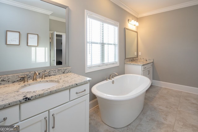 bathroom featuring crown molding, a sink, and baseboards