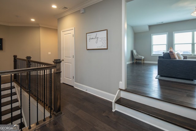 staircase featuring recessed lighting, visible vents, ornamental molding, and wood finished floors