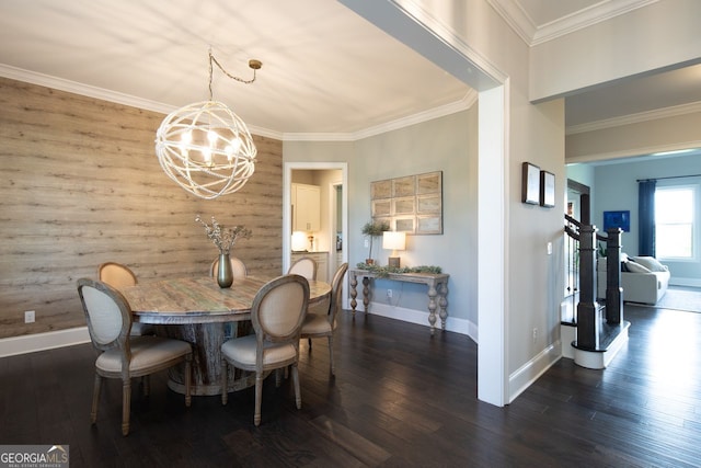 dining space with baseboards, dark wood-style flooring, crown molding, and a notable chandelier