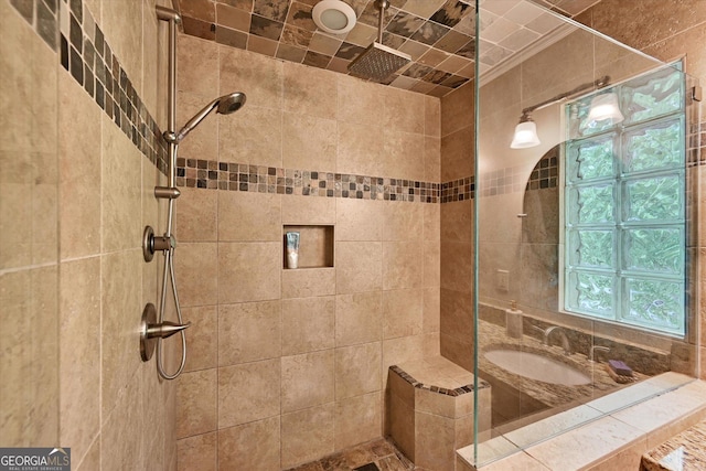 bathroom with a tile shower