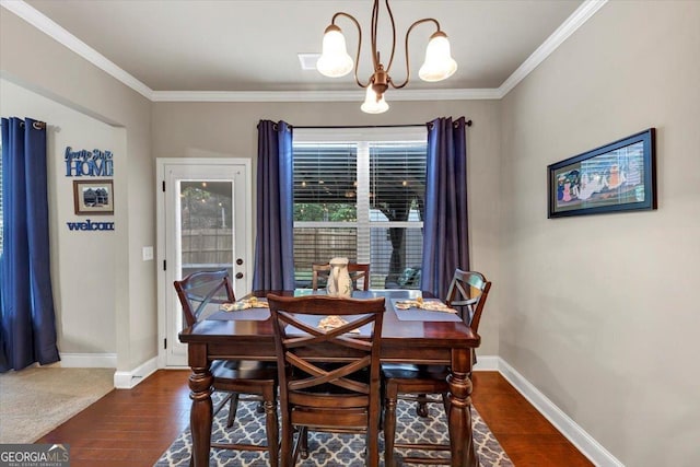 2376 Roberts View Trl, Buford, GA 30519 - dining space with an inviting chandelier, dark wood finished floors, baseboards, and ornamental molding