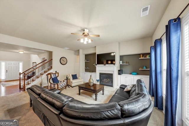2376 Roberts View Trl, Buford, GA 30519 - living room with ceiling fan, stairs, a healthy amount of sunlight, and visible vents