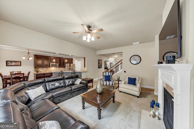 2376 Roberts View Trl, Buford, GA 30519 - living room with ceiling fan, stairs, baseboards, and a fireplace with flush hearth