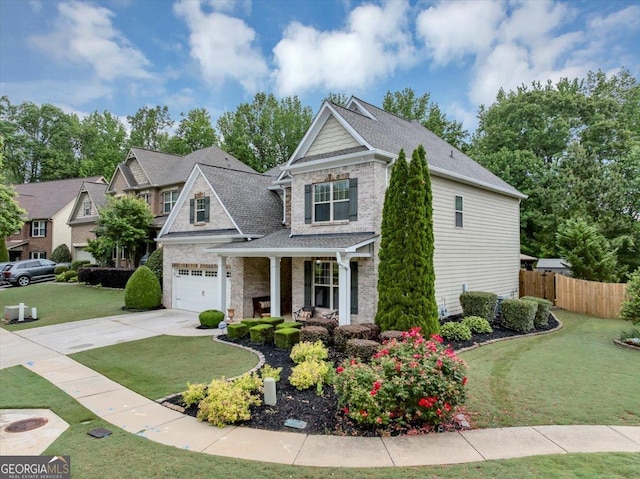 2376 Roberts View Trl, Buford, GA 30519 - craftsman-style home featuring covered porch, fence, driveway, a garage, and a front lawn