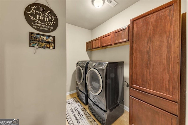 2376 Roberts View Trl, Buford, GA 30519 - laundry room with washing machine and dryer, cabinet space, baseboards, and visible vents