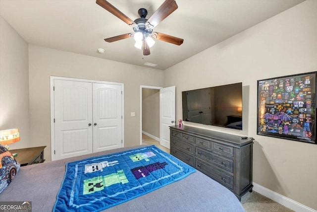 2376 Roberts View Trl, Buford, GA 30519 - carpeted bedroom with baseboards, a closet, visible vents, and a ceiling fan